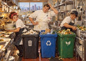 Three chefs in a busy kitchen stand behind black, blue, and green bins, helping the restaurant comply with Denver Waste No More recycling and composting requirements.