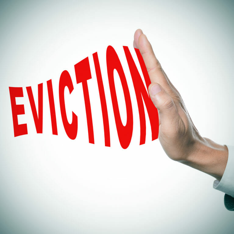 man hand stopping the word eviction