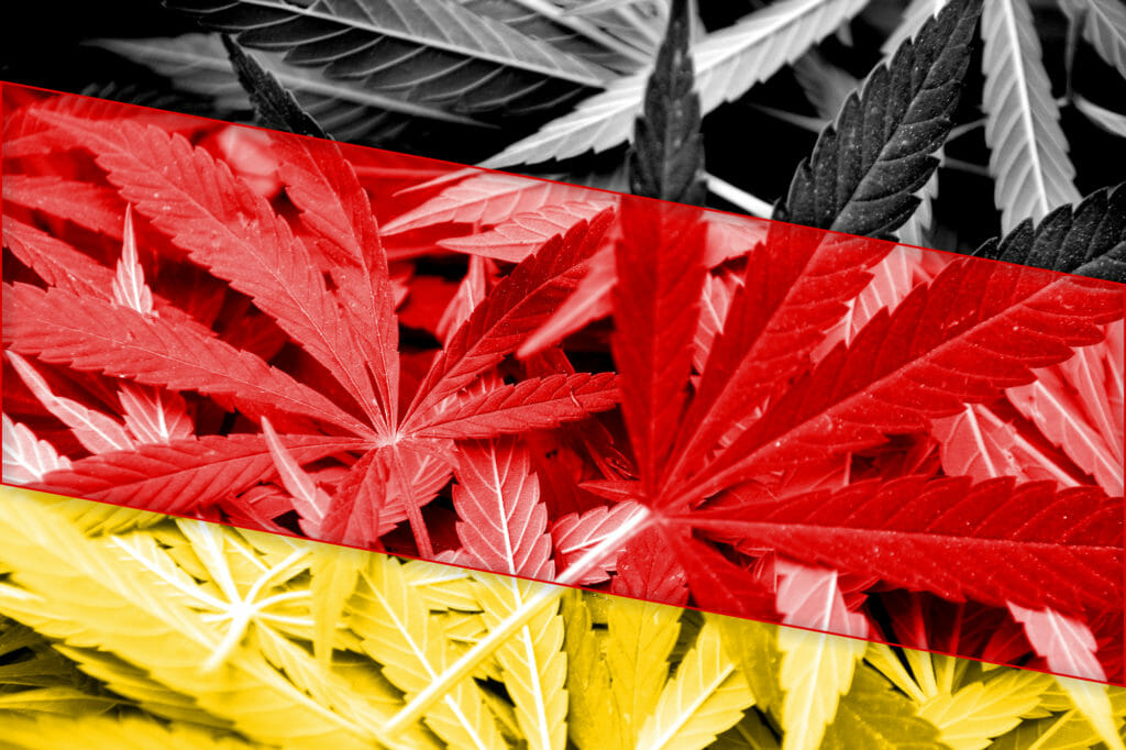 Bandera de Alemania sobre fondo de cannabis