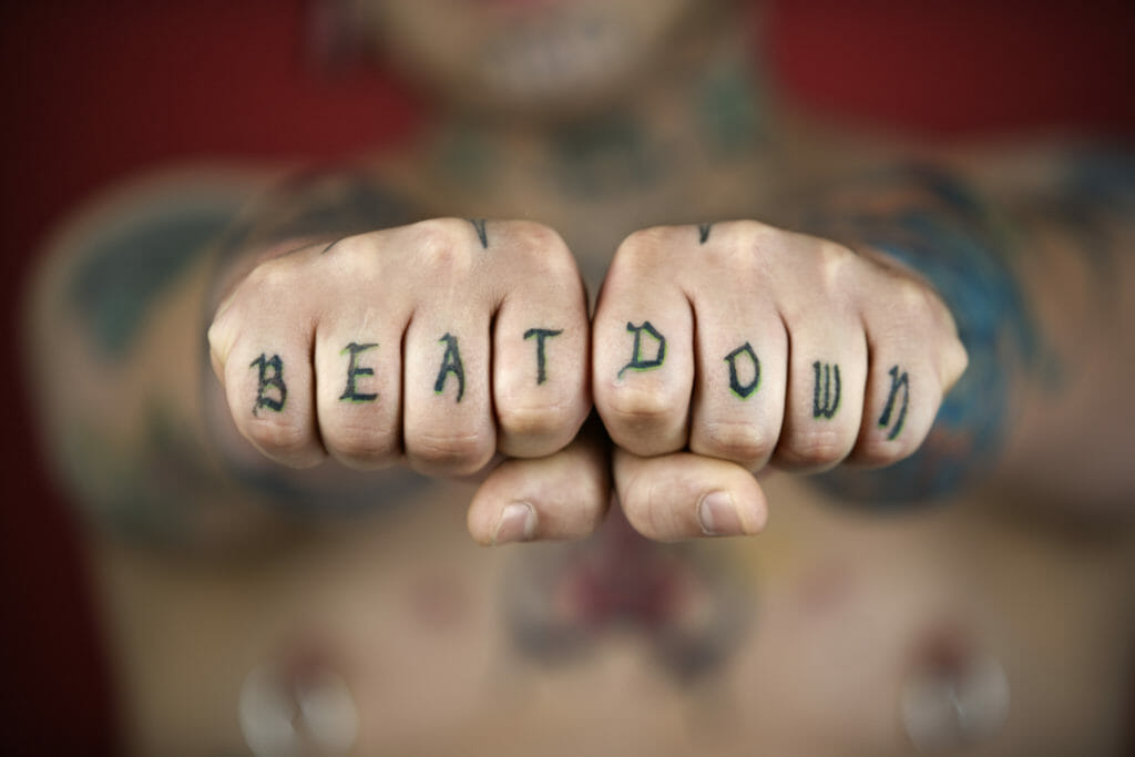 "beat down" tattoo on knuckles