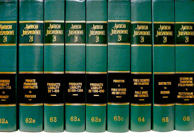 A row of green books on a white background.
