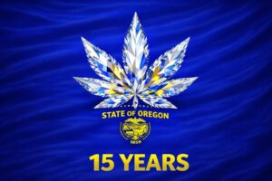 A diamond-patterned cannabis leaf, symbolizing Oregon cannabis, sits above the state seal and "15 YEARS" in yellow on a blue background with "STATE OF OREGON" text.