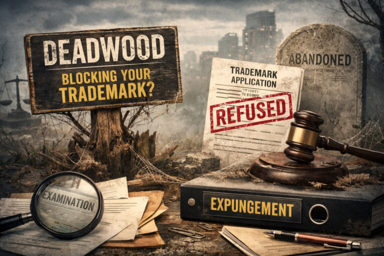 A weathered trademark sign reads “Deadwood Blocking Your Trademark?” beside documents labeled “Examination,” “Trademark Application Refused,” “Expungement,” and an “Abandoned” gravestone.