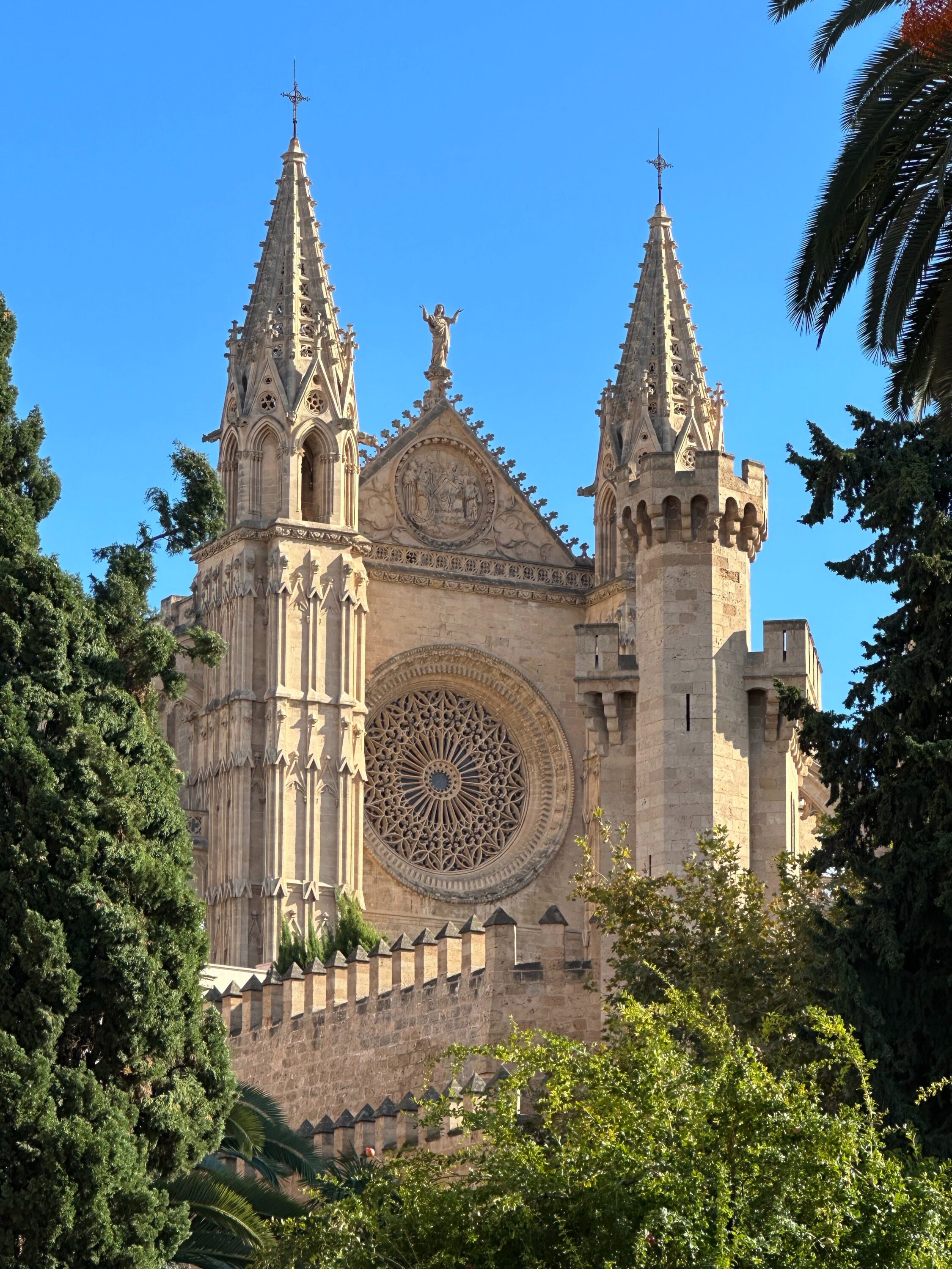 An ornate cathedral surrounded by trees.