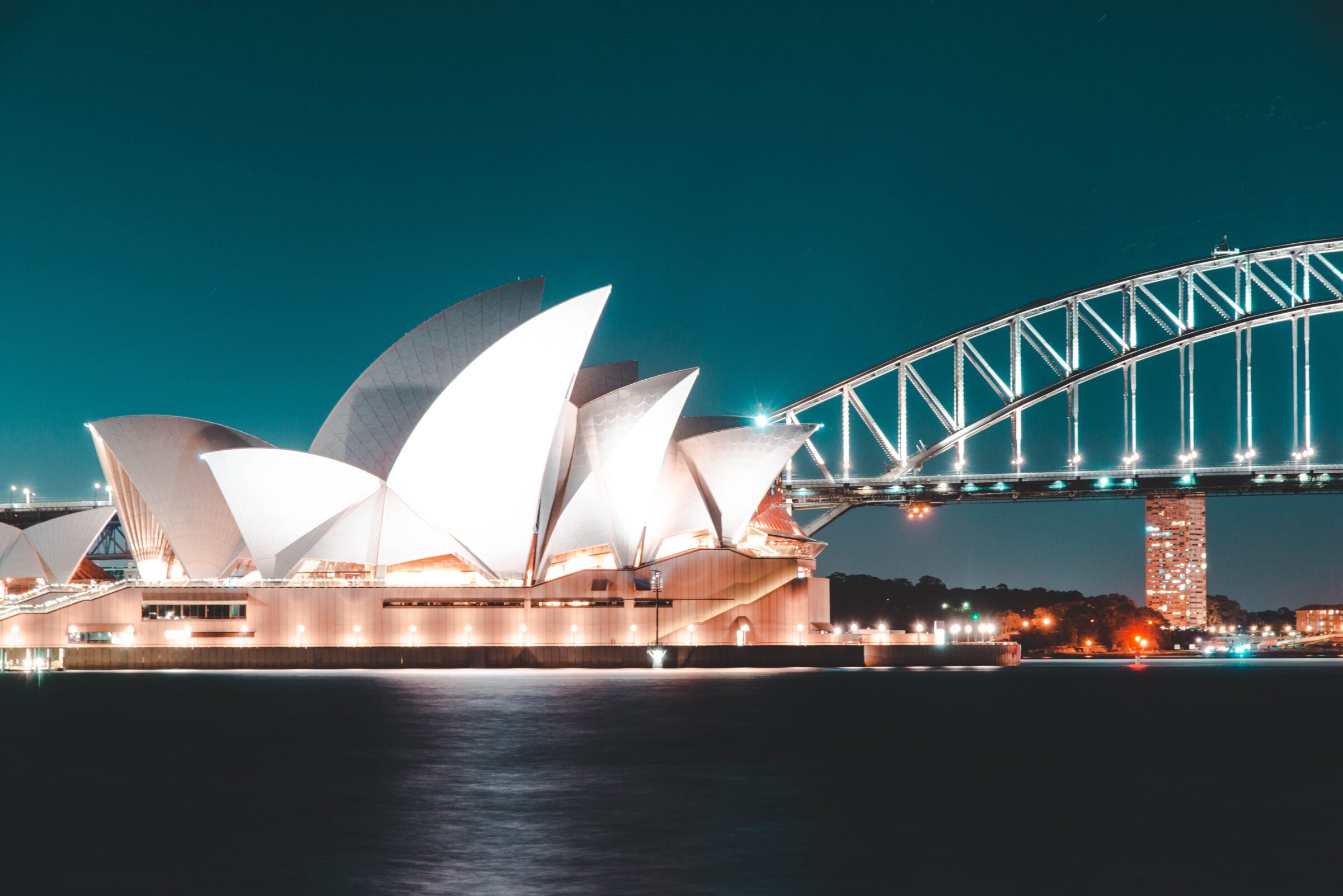 Sydney opera house and bridge at night.
